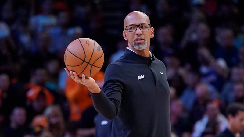 Phoenix Suns head coach Monty Williams hands off the ball during a break in the action during...