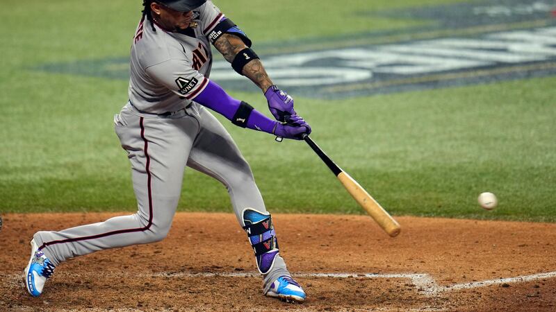 Arizona Diamondbacks' Ketel Marte hits a two-run single against the Texas Rangers during the...