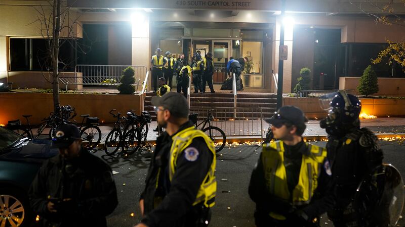 U.S. Capitol Police stand outside the headquarters of the Democratic National Committee...