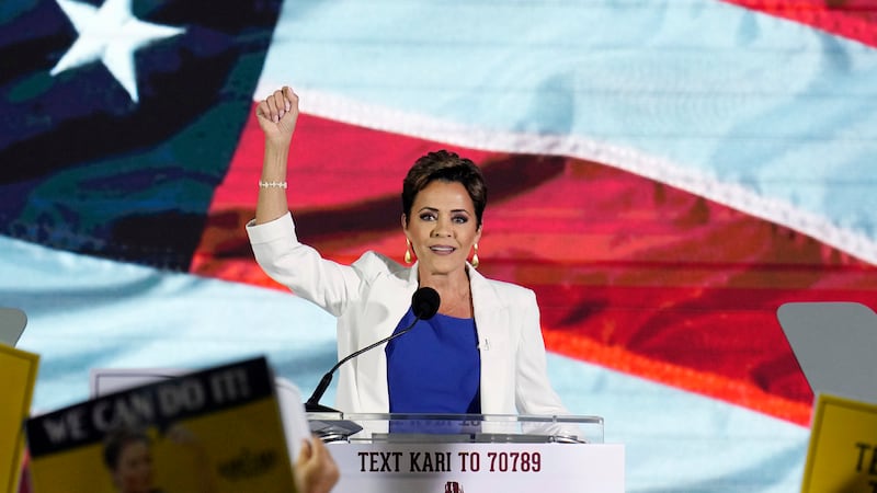 FILE - Republican Kari Lake waves to supporters as she announces her plans to run for the...