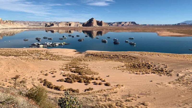 File -- Houseboats on Lake Powell on Dec. 13, 2021, near Wahweap Marina, where the...