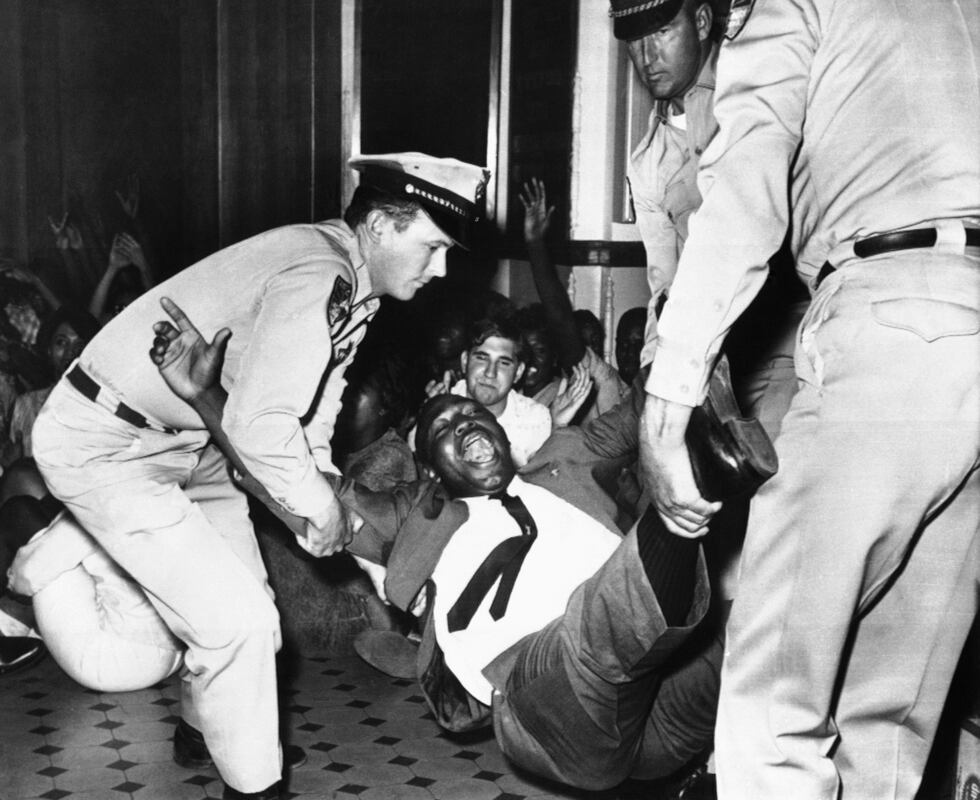 Arizona highway patrolmen ejected more than 100 civil rights demonstrators bodily from the...