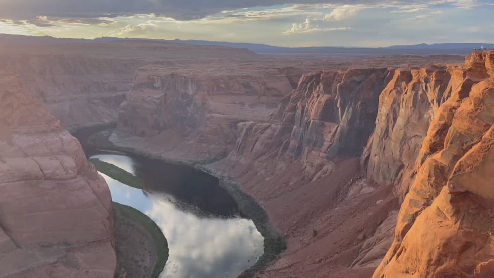 The Colorado River winds through the area, from the Glen Canyon Dam, down toward the Grand...
