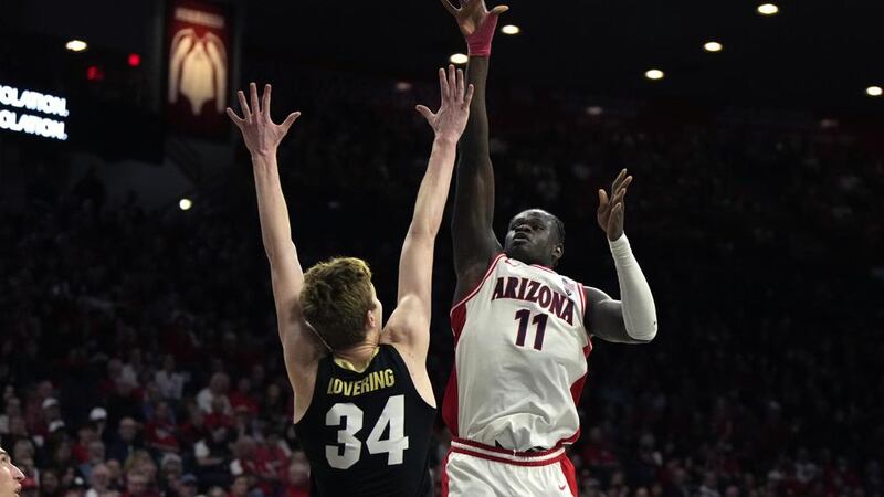 Arizona center Oumar Ballo (11) shoots over Colorado center Lawson Lovering (34) during the...