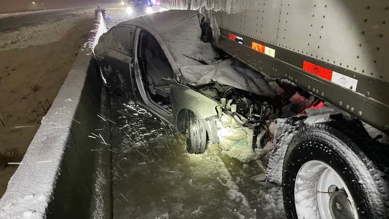 The Kia was dragged eight miles on the interstate before the semi driver noticed. The woman...