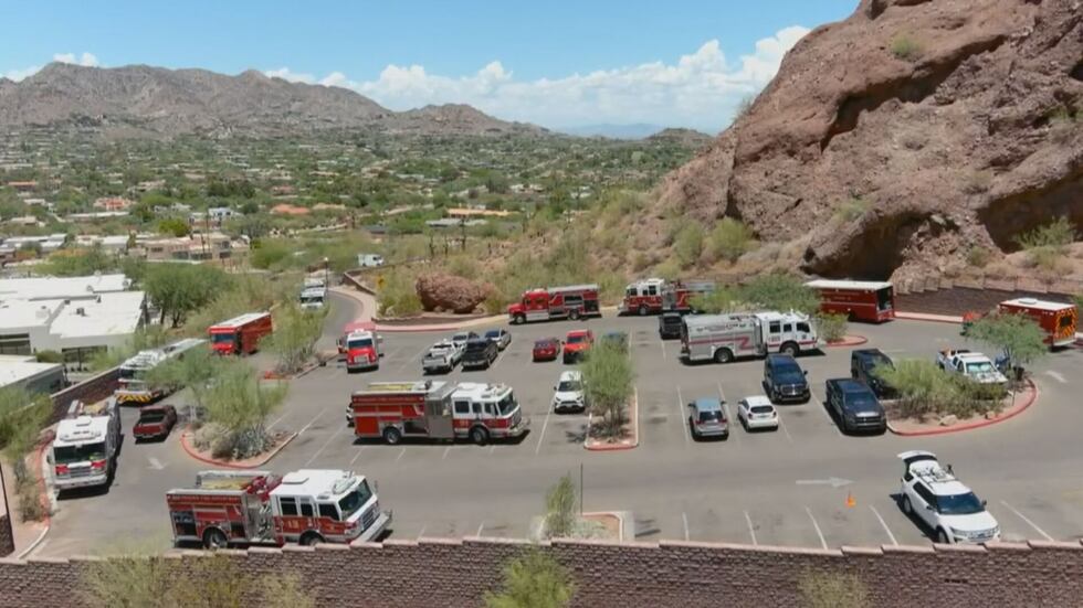 This image shows an aerial view of the parking lot near Echo Canyon with multiple Phoenix Fire...