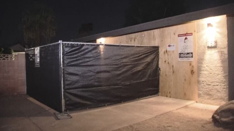 Video from the scene showed a home boarded up.