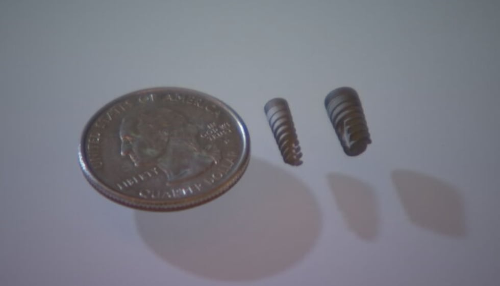 This photo shows how the size of a dental implant compares to the size of a penny. Its height...