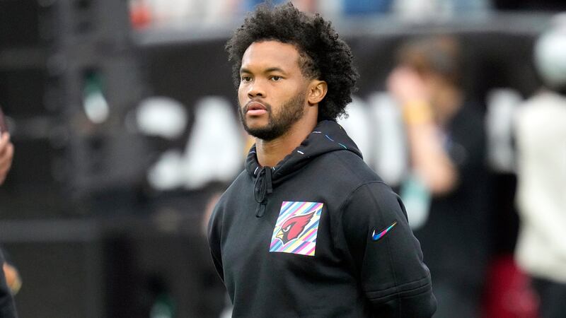 FILE - Arizona Cardinals quarterback Kyler Murray pauses on the field prior to an NFL football...