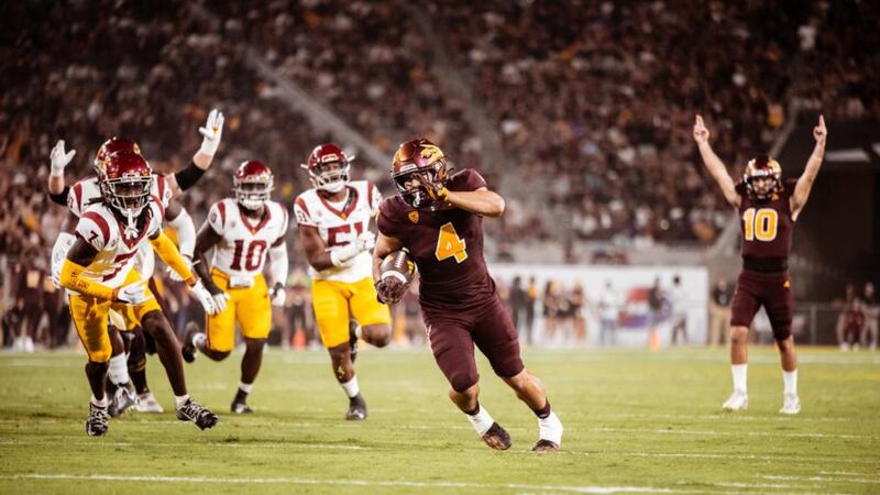 Cam Skattebo runs for a touchdown against USC.