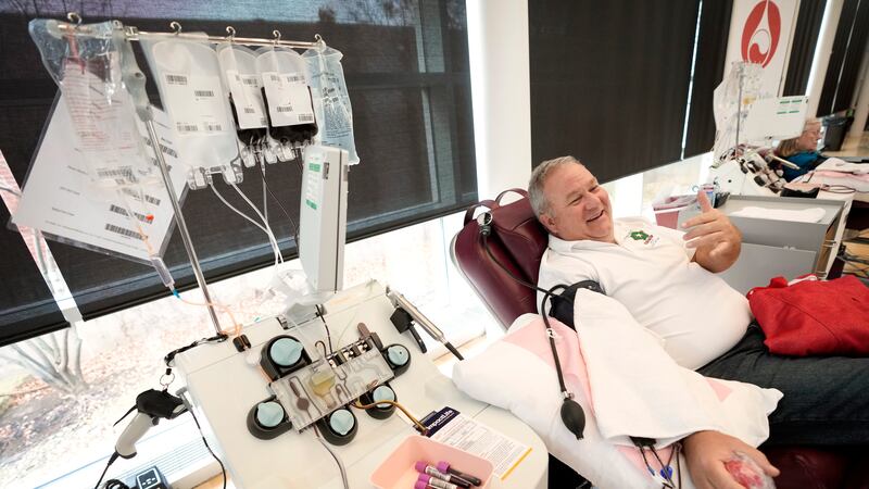 Matt Schermerhorn talks about donating blood at the Impact Life blood center, Friday, Nov. 11,...