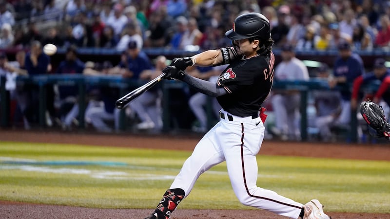 Arizona Diamondbacks' Corbin Carroll connects for a two-run home run against the Boston Red...