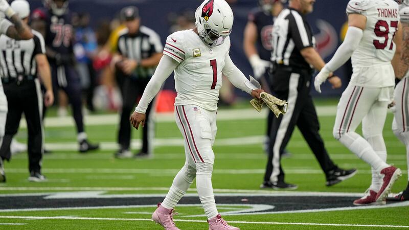 Arizona Cardinals quarterback Kyler Murray (1) walks off the field after throwing an...