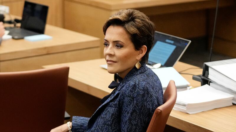 Former Arizona Republican governor candidate Kari Lake sits in court at Maricopa County...