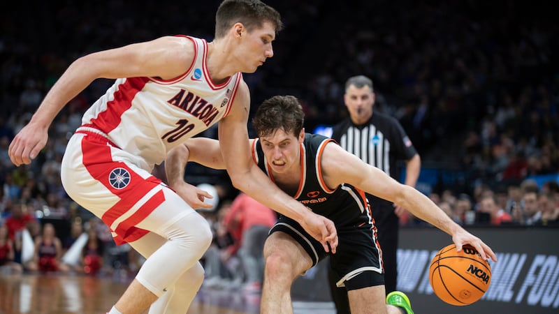 Arizona forward Azuolas Tubelis (10) defends Princeton guard Ryan Langborg (3) during the...