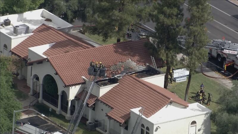 The roof at a law office in Mesa caught fire and about 30 people had to be evacuated Wednesday...