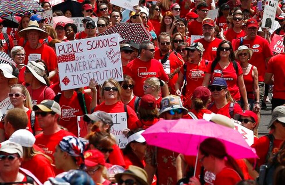 FILE - In this April 26, 2018, file photo, thousands march to the Arizona Capitol for higher...