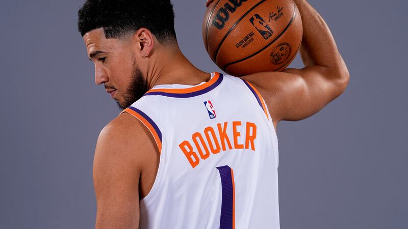Phoenix Suns' Devin Booker poses for a portrait during the NBA basketball team's media day,...