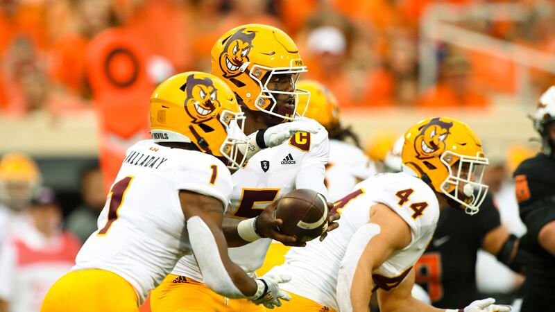 Arizona State fullback Case Hatch (44) rushes forward as quarterback Emory Jones (5) hands off...