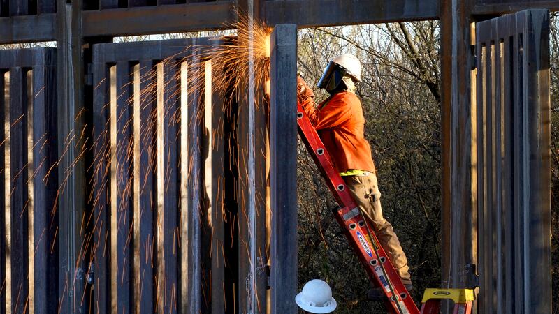 FILE - Crews construct a section of border wall in San Bernardino National Wildlife Refuge,...