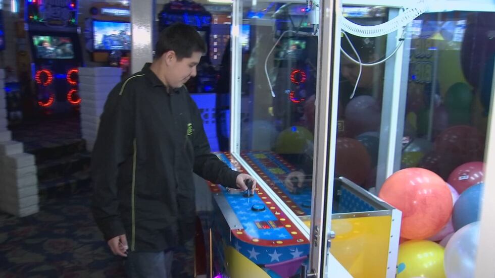 Owen won a prize from the claw machine on his first try!