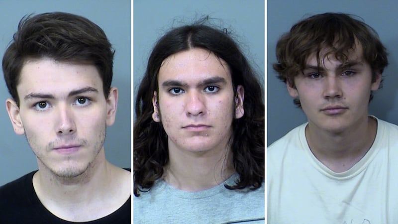Police took Trevor Benoit (left), Peter Fraenkel (middle) and Lukas Patton (right) into...